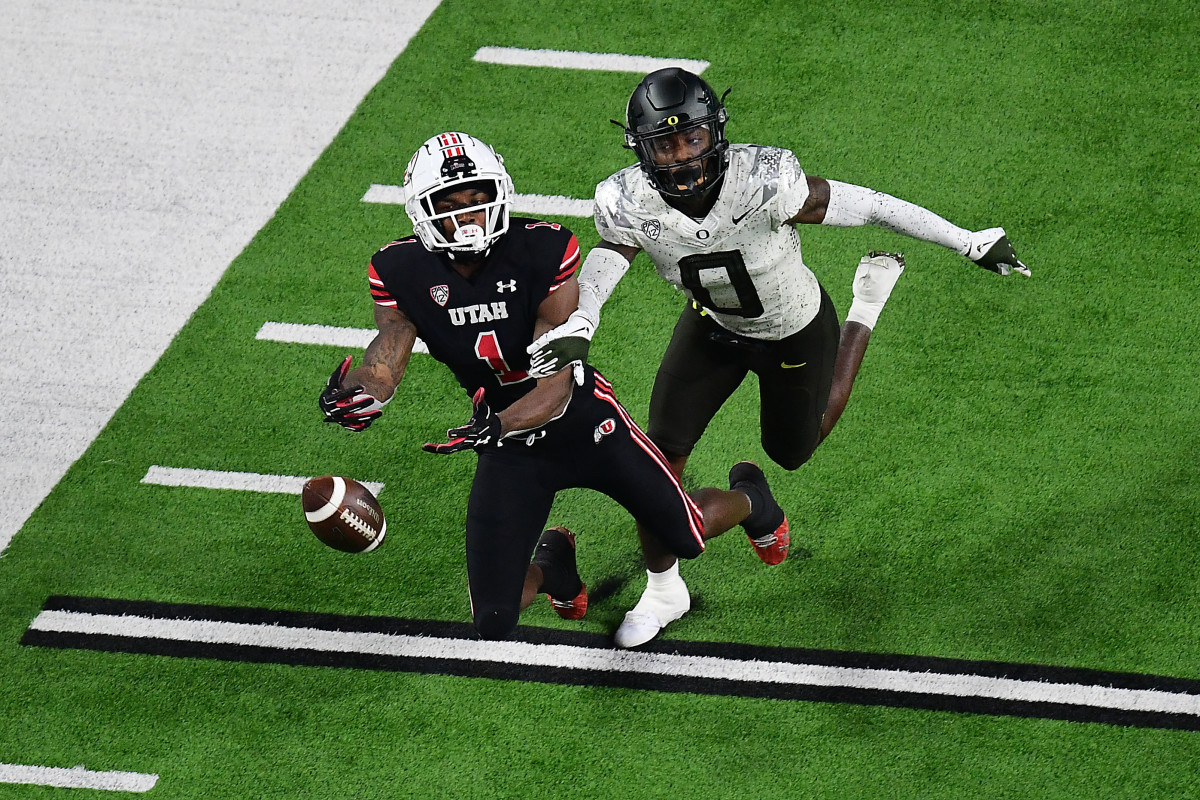 December 3, 2021; Las Vegas, NV, USA; Oregon Ducks cornerback DJ James (0) defends against Utah Utes wide receiver Theo Howard (1) during the second half in the 2021 Pac-12 Championship Game at Allegiant Stadium. Mandatory Credit: Gary A. Vasquez-USA TODAY Sports